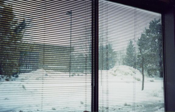 The view from a conference room as it snows outside.